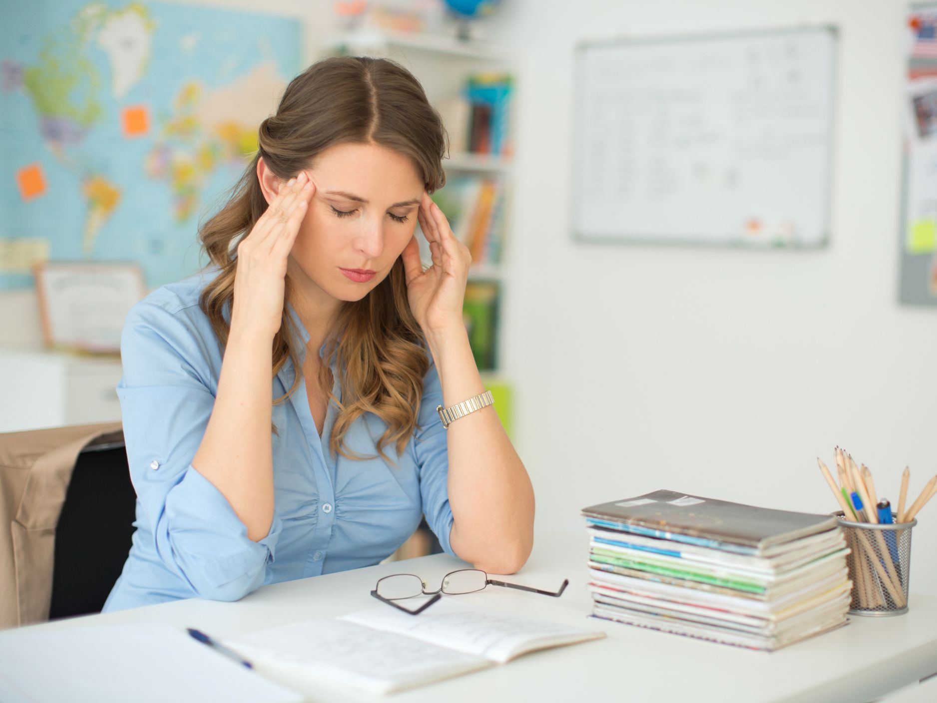 Stressed teacher in classroom